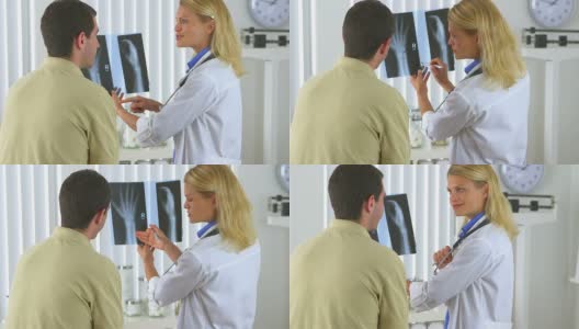 医生正在检查男性病人的x光片高清在线视频素材下载