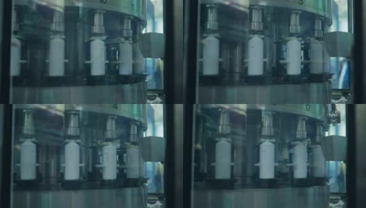 化学工厂中用于装瓶液体肥皂的输送装置高清在线视频素材下载