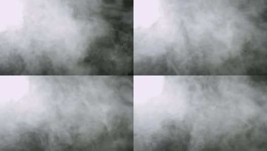 烟的背景。抽象的烟雾云。黑色背景上慢动作的烟雾高清在线视频素材下载