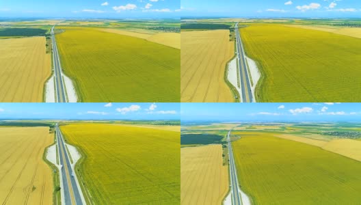 超宽航拍无人机下降在高速公路和向日葵小麦农田高清在线视频素材下载