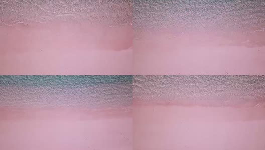 粉红色的海滩水晶清澈的水在科莫多国家公园印度尼西亚鸟瞰图4K高清在线视频素材下载