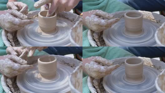 陶工的双手在陶工轮上用粘土工作高清在线视频素材下载