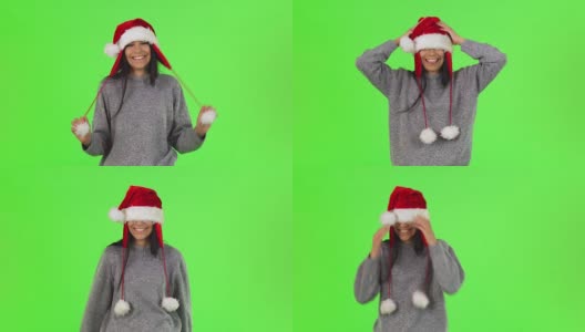 一个可爱的圣诞老人女孩在工作室玩得很开心高清在线视频素材下载