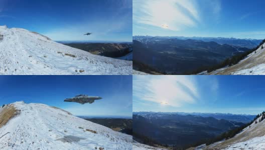 宇宙飞船在飞行，外星人的宇宙飞船飞过雪山与蓝天的背景高清在线视频素材下载