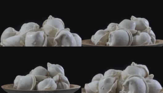 一堆在盘子里旋转的饺子高清在线视频素材下载