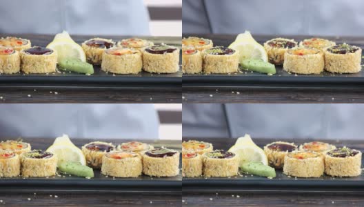 用切碎的开心果装饰的寿司。高清在线视频素材下载