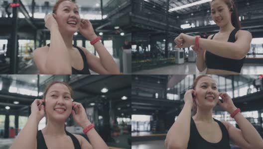 年轻的女运动员在健身房用智能手机听音乐。高清在线视频素材下载