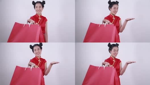 女人拿着购物袋和打开手掌的概念春节快乐高清在线视频素材下载