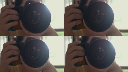 一个女人正在用相机拍照高清在线视频素材下载