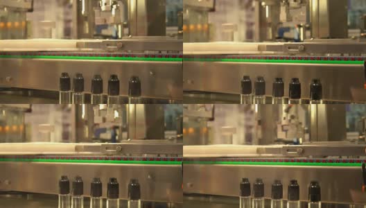 工业用机器人，用于在装有螺纹密封盖的瓶子中分配药物高清在线视频素材下载