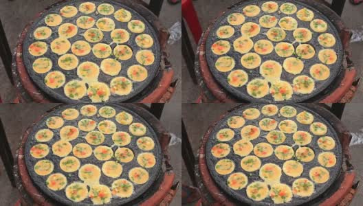 泰国街头泰国菜，小贩准备用鹌鹑蛋煎蛋，泰国市场高清在线视频素材下载