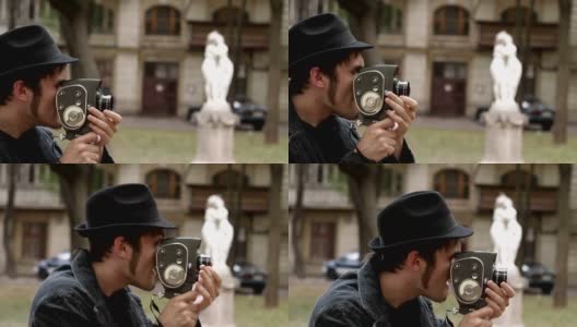 男子用老式相机拍摄电影高清在线视频素材下载