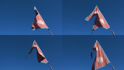 蓝天背景下飘扬的尼泊尔国旗高清在线视频素材下载