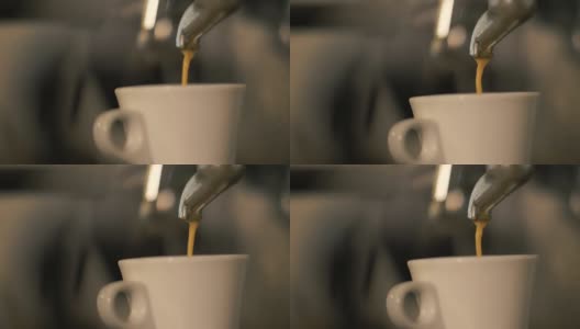 近距离观察从自助餐厅的咖啡机倒进白色杯子里的浓咖啡高清在线视频素材下载