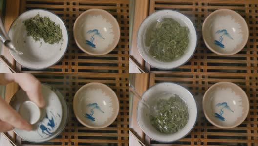 师傅将热水倒入盛有绿茶的碗中，盖上盖子，从上往下看高清在线视频素材下载