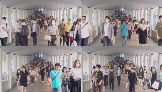 4K分辨率慢镜头拍摄亚洲人在早高峰时间在曼谷上班时戴着预防冠状病毒或新冠病毒的面罩和空气中的微尘pm 2.5高清在线视频素材下载