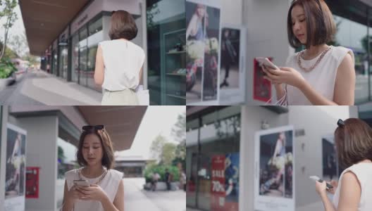 用智能手机在网上购物的女人高清在线视频素材下载