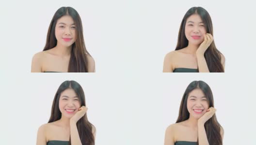 亚洲美丽的少女快乐的表情和看着相机在白色的背景。高清在线视频素材下载