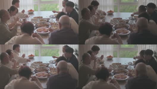 中国多代同堂的一家人在除夕夜吃团圆饭高清在线视频素材下载