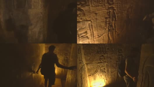 一个年轻人正在参观阿斯旺市附近的Edfu寺庙的隧道。埃及。飞机从后面跟着。在尼罗河河畔的Edfu城，希腊罗马建筑，献给荷鲁斯高清在线视频素材下载