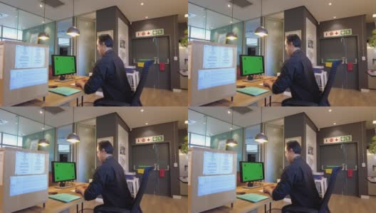 一个男性在开放式办公室使用科技进行交流的后视图高清在线视频素材下载