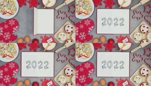 圣诞甜点饼干和烘焙材料制作了印有2022年数字的开本框架。停止运动高清在线视频素材下载