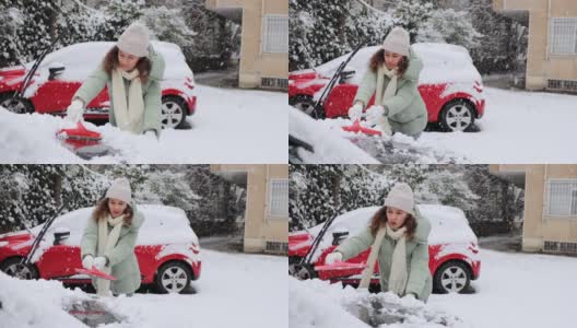 年轻女子正在清理车上的雪高清在线视频素材下载