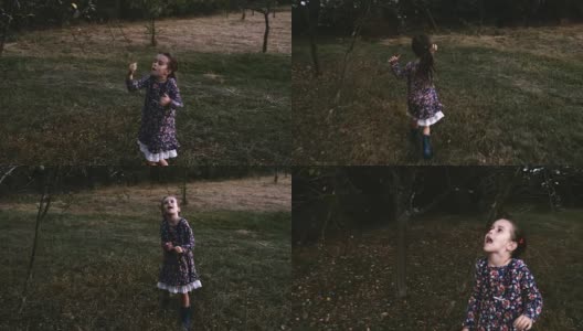 一个快乐的小女孩在地里玩。她年轻时的快乐回忆高清在线视频素材下载