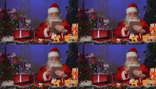 圣诞老人在数字平板电脑上工作高清在线视频素材下载