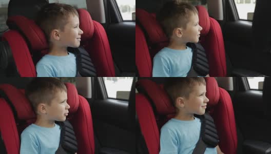 好奇的男孩在婴儿座椅上开车时告诉我们一些事情高清在线视频素材下载