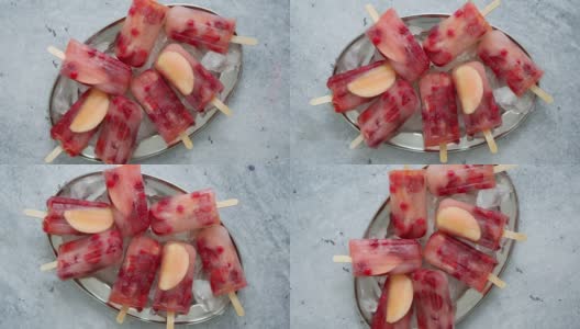 金属盘自制覆盆子、草莓、苹果和醋栗冰棒，配各种浆果冰高清在线视频素材下载