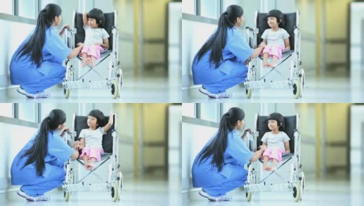 亚洲印第安小女孩轮椅医院走廊高清在线视频素材下载