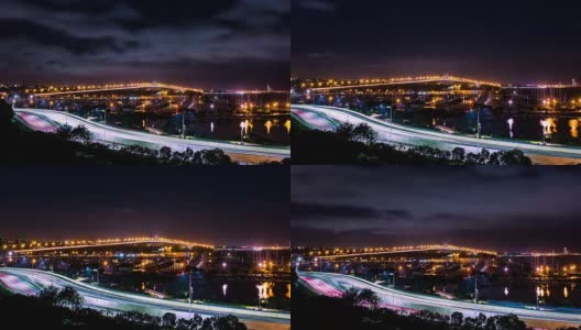在海上亮着灯的桥和高速公路上行驶的汽车的时间流逝高清在线视频素材下载