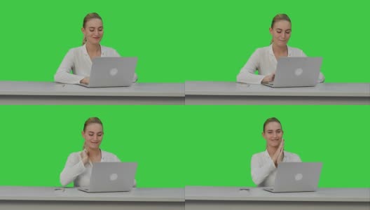 快乐的女商人喜欢在笔记本电脑上工作，想象一下这个项目，然后在绿色屏幕上写下Chroma Key高清在线视频素材下载