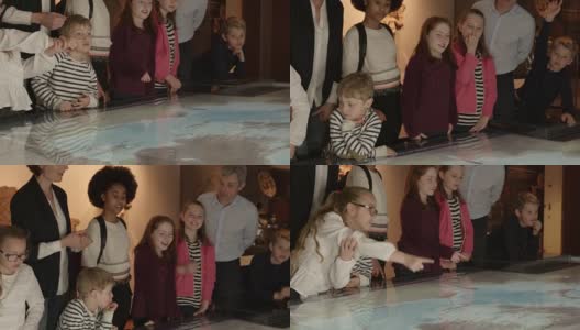 小学生在学校旅行到博物馆看地图拍摄在R3D高清在线视频素材下载