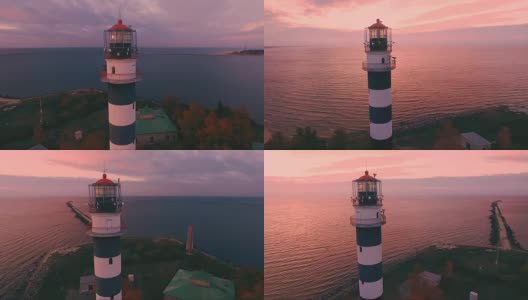 高地灯塔在海滩上傍晚日落-鸟瞰图高清在线视频素材下载
