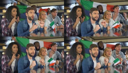一群观看比赛的球迷挥舞着意大利国旗为国家队加油高清在线视频素材下载