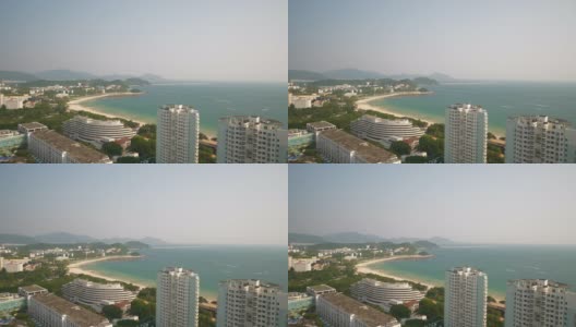 阳光明媚的一天三亚市著名的海滩湾酒店屋顶全景4k海南中国高清在线视频素材下载