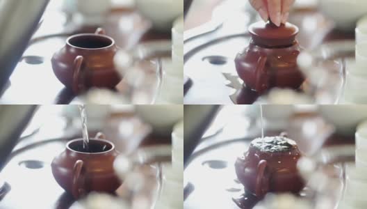 用手把热水从茶壶里倒出来。高清在线视频素材下载
