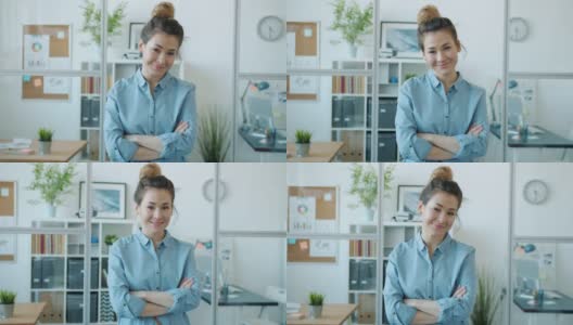 快乐的亚洲女士的肖像站在现代玻璃墙办公室微笑看着相机高清在线视频素材下载