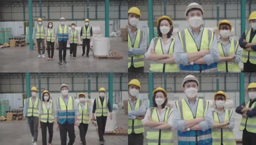 微笑自信的工人队伍站在仓库里高清在线视频素材下载