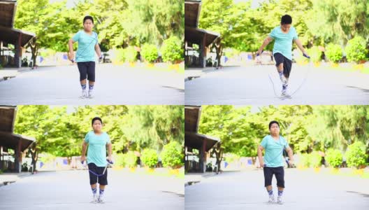 亚洲男孩跳绳锻炼，学校放假期间在学校锻炼阻止Covid-19高清在线视频素材下载