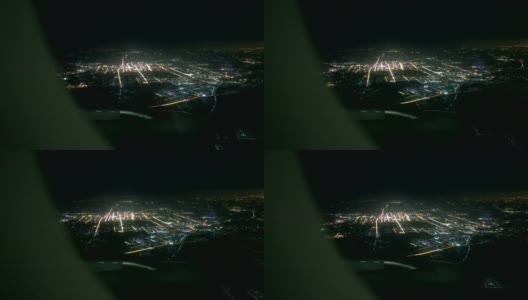 夜间在城市上空飞行的飞机高清在线视频素材下载