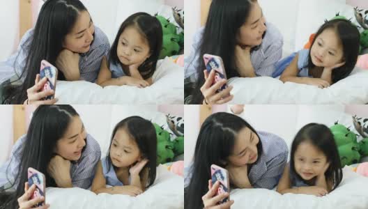 亚洲母女都喜欢玩智能手机高清在线视频素材下载