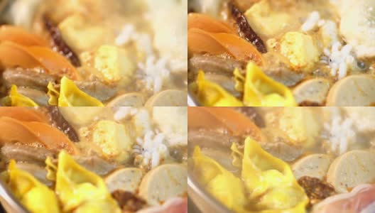 美味的泰国火锅风格，各种食材在水中煮沸。高清在线视频素材下载