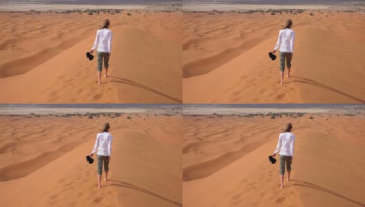 赤脚穿过沙漠的女人高清在线视频素材下载