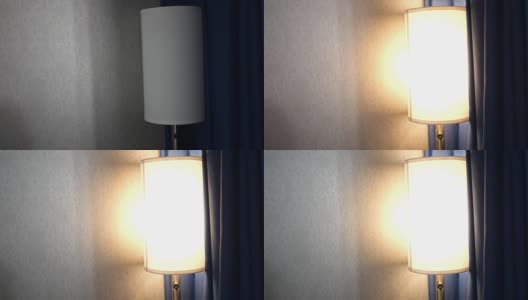 一盏现代灯在黑暗的卧室里打开——ALT高清在线视频素材下载