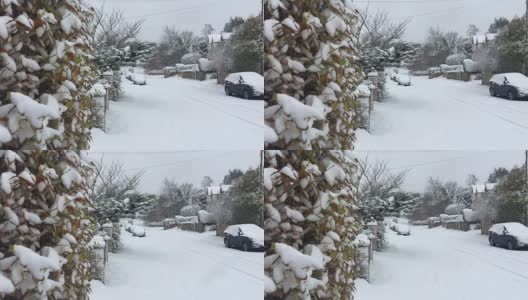 厚厚的冬雪掩盖了传统的英国巷(高清，慢动作)高清在线视频素材下载