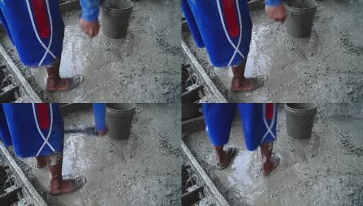 建筑工铲混凝土浆液从混凝土搅拌机中倒出高清在线视频素材下载