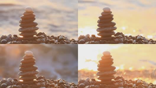日出时在海滩上的一堆石头高清在线视频素材下载